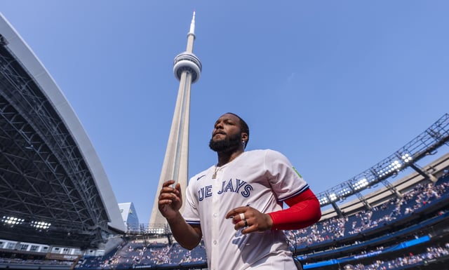 TORONTO, ON - AUGUST 14: Vladimir Guerrero Jr. #27 of the Toronto Blue Jays looks on under the CN Tower after his team defeated the Chicago Cubs in their MLB game at Rogers Centre on August 14, 2025 in Toronto, Ontario, Canada. (Photo by Mark Blinch/Getty Images)