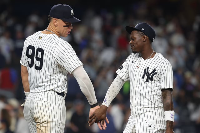 NEW YORK, NEW YORK - AUGUST 24: Jazz Chisholm Jr. #13 and Aaron Judge #99 of the New York Yankees celebrate a 7-2 win over the Boston Red Sox at Yankee Stadium on August 24, 2025 in New York City.