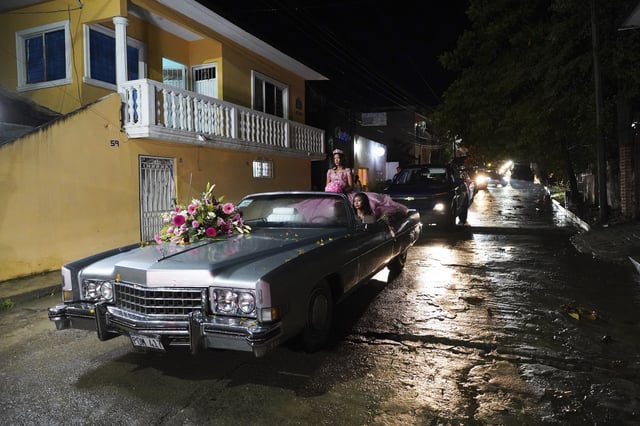 Isela Santiago Morales rides for her 15th birthday party at a stadium in Axtla de Terrazas, Mexico, Saturday, Aug. 23, 2025, organized by the community after her father's social media appeal drew support following her first sparsely attended party. (AP Photo/Mauricio Palos)