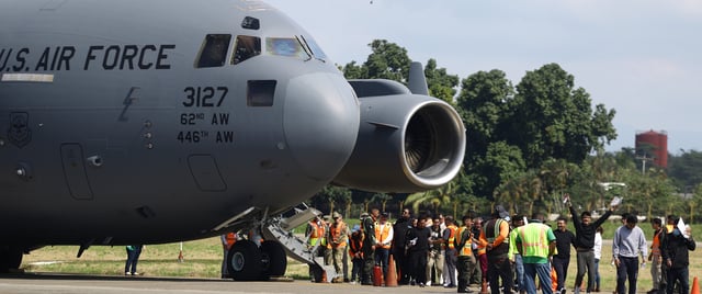 US Air Force flight carrying deported migrants by the US government arrive at Ramon Villeda Morales International Airport on January 31 in San Pedro Sula, Honduras. (Photo by Jorge Salvador Cabrera/Getty Images)