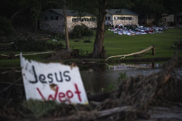 FILE - Camper's belongings sit outside one of Camp Mystic's cabins near the Guadalupe River after a flash flood swept through the area, July 7, 2025, in Hunt, Texas. (AP Photo/Eli Hartman, file)