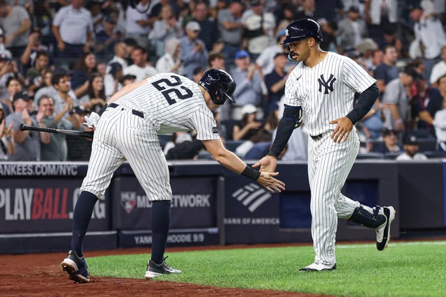 NEW YORK, NEW YORK - AUGUST 24: Trent Grisham #12 of the New York Yankees celebrates his solo home run with Ben Rice #22 against the Boston Red Sox during the third inning at Yankee Stadium on August 24, 2025 in New York City.