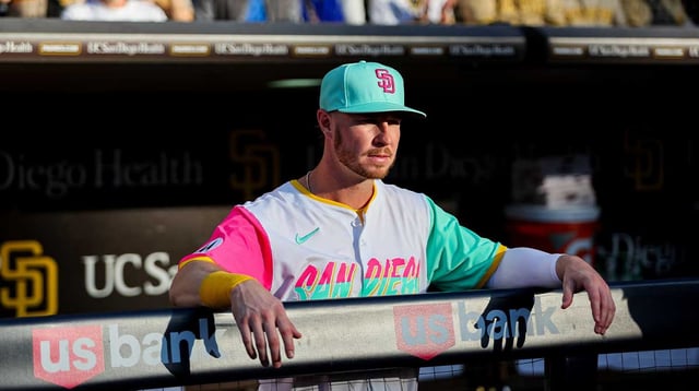 Aug 1, 2025; San Diego, California, USA; San Diego Padres first baseman Ryan O'Hearn (32) looks on from the dugout before the game against the St. Louis Cardinals at Petco Park. Mandatory Credit: Chadd Cady-Imagn Images