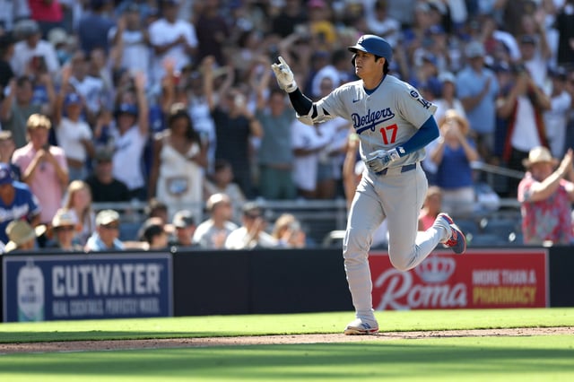 Shohei Ohtani #17 of the Los Angeles Dodgers rounds third base after connecting for a solo homerun during the ninth inning of a game against the San Diego Padres at Petco Park on August 24, 2025 in San Diego, California. (Photo by Sean M. Haffey/Getty Images)