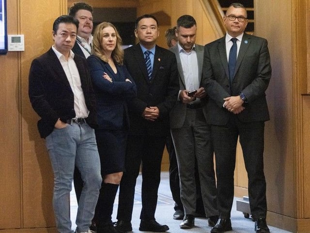 Mayor Ken Sim and city council after voting on a 5.5 per cent increase in property taxes at City Hall on Dec. 10, 2024. 
