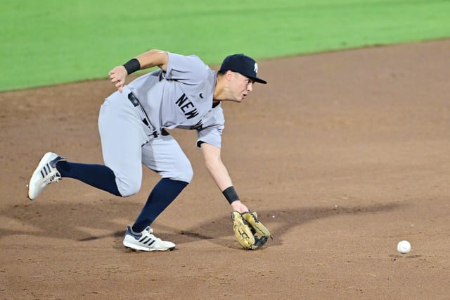TAMPA, FLORIDA - AUGUST 20: Anthony Volpe #11 of the New York Yankees fields a ground ball in the third inning against the Tampa Bay Rays at George M. Steinbrenner Field on August 20, 2025 in Tampa, Florida.