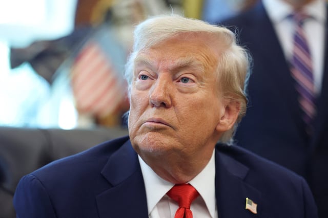 U.S. President Donald Trump looks on during the signing of executive orders in the Oval Office at the White House in Washington, D.C., U.S., August 25, 2025. REUTERS/Jonathan Ernst