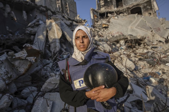 Freelance journalist Mariam Dagga, 33, who had been working with the Associated Press and other outlets during the Gaza war, poses for a portrait in Khan Younis, southern Gaza Strip, on June 14, 2024. She was among at least 19 people, including four journalists, killed Monday in Israeli strikes on Nasser Hospital in Khan Younis. (AP Photo/Jehad Alshrafi)