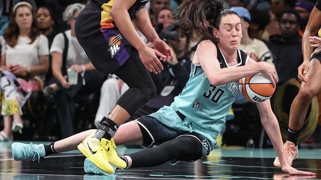 Jul 25, 2025; Brooklyn, New York, USA; New York Liberty forward Breanna Stewart (30) tries to hold her dribble as she falls to the court in the third quarter against the Phoenix Mercury at Barclays Center. Mandatory Credit: Wendell Cruz-Imagn Images