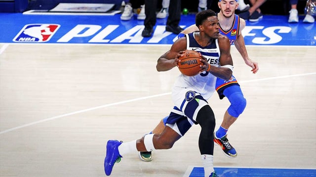 May 28, 2025; Oklahoma City, Oklahoma, USA; Minnesota Timberwolves guard Anthony Edwards (5) drives to the basket against Oklahoma City Thunder guard Alex Caruso (9) during the third quarter in game five of the western conference finals for the 2025 NBA Playoffs at Paycom Center. Mandatory Credit: Alonzo Adams-Imagn Images