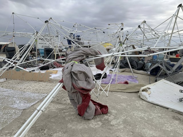 Fierce dust storms destroyed many campsites the evening before Burning Man was set to officially begin in the Black Rock Desert on Aug. 23, 2025. The entrance gates to Burning Man reopened Monday morning after storms shut down the festival’s main access point over the weekend. But thousands of attendees faced wait times of six to eight hours on the road into the desert, according to organizers.