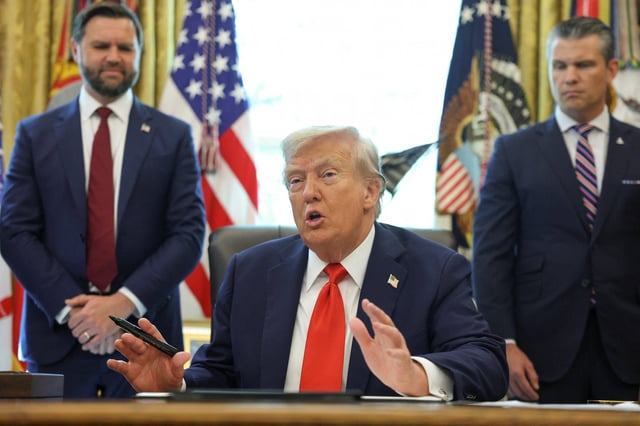 President Donald Trump speaks after signing an executive order, as Vice President JD Vance and Defense Secretary Pete Hegseth look on in the White House Oval Office on Aug. 25, 2025.