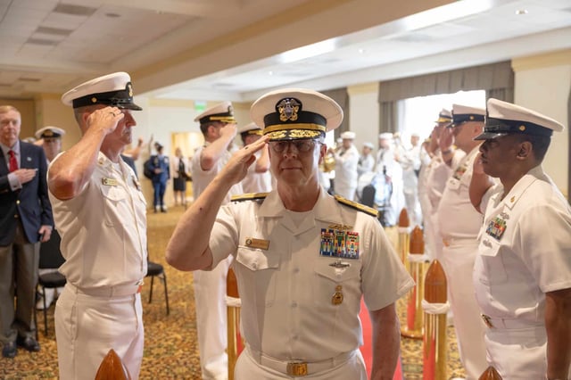 Adm. Daryl Caudle salutes the sideboys during a U.S. Fleet Forces Command (USFFC) Relinquishment of Command ceremony aboard Naval Station Norfolk, August 6, 2025. (U.S. Navy photo by Mass Communication Specialist 2nd Class Dustin Knight/Released)