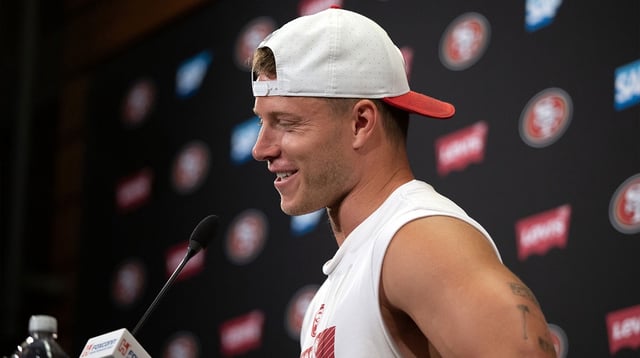 Jun 11, 2025; Santa Clara, CA, USA; San Francisco 49ers running back Christian McCaffrey speaks to the media following a team OTA at Levi's Stadium. Mandatory Credit: D. Ross Cameron-Imagn Images.