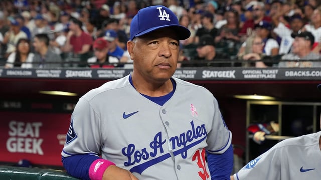 May 11, 2025; Phoenix, Arizona, USA; Los Angeles Dodgers manager Dave Roberts (30) gets ready for a game against the Arizona Diamondbacks at Chase Field. Mandatory Credit: Rick Scuteri-Imagn Images