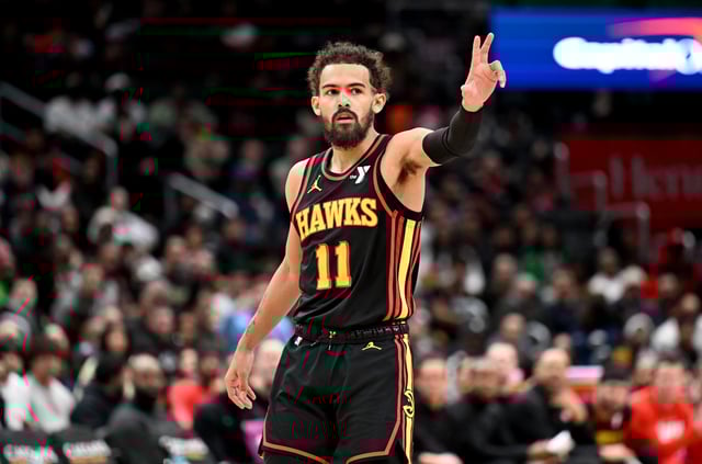 WASHINGTON, DC - FEBRUARY 08: Trae Young #11 of the Atlanta Hawks celebrates in the third quarter against the Washington Wizards at Capital One Arena on February 08, 2025 in Washington, DC.