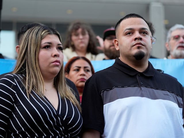 Jennifer Vasquez Sura, left, and her husband Kilmar Abrego Garcia attend a protest rally at the Immigration and Customs Enforcement field office in Baltimore, Monday, Aug. 25, 2025, to support Abrego Garcia. (AP Photo/Stephanie Scarbrough)