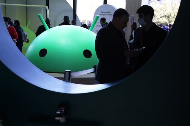 Attendees visit the Google booth where a model of the Android logo is on display at CES 2023 at the Las Vegas Convention Center on January 06, 2023. (Photo by Alex Wong/Getty Images)