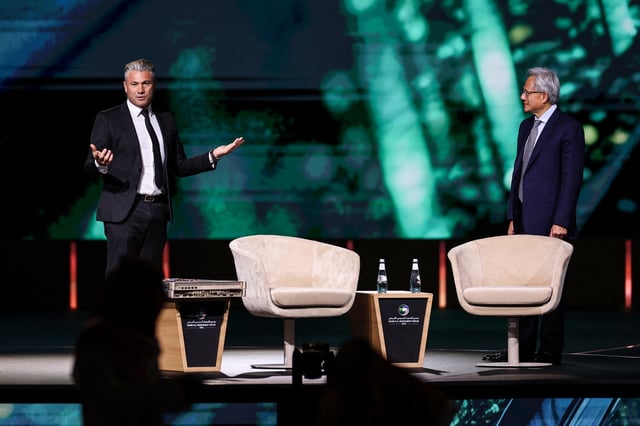 Tareq Amin, CEO of Humain, and Jensen Huang, CEO of NVIDIA, attend the Saudi-U.S. Investment Forum, in Riyadh, Saudi Arabia May 13, 2025. REUTERS/Hamad I Mohammed/File Photo