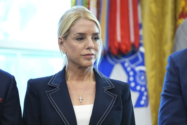 Attorney General Pam Bondi listens as President Donald Trump holds an executive order signing ceremony in the Oval Office of the White House, Monday, Aug. 25, 2025, in Washington. (AP Photo/Evan Vucci)
