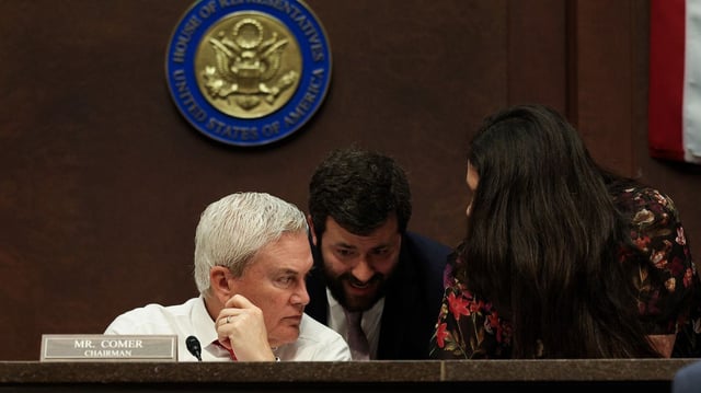 Rep. James Comer speaks with his aides during a House Oversight Committee meeting on March 25. Photo: Kayla Bartkowski/Getty Images