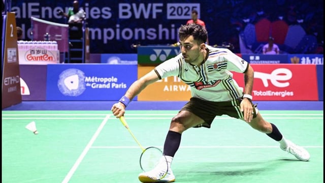 India's Lakshya Sen hits a return to shi China's Shi Yu Qi during their men's singles match at the BWF World Championships in Paris. (AFP)