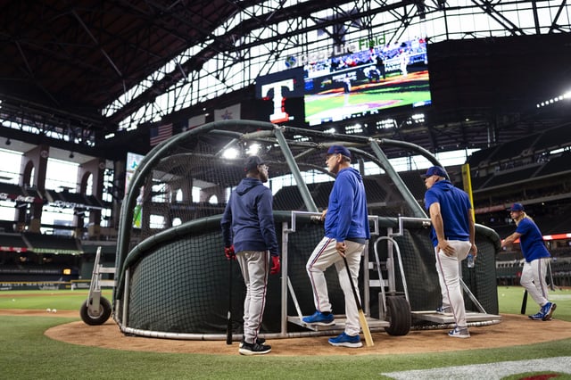 Ron Washington of the Atlanta Braves talks with Manager Bruce Bochy #15 of the Texas Rangers during batting practice prior to a game at Globe Life Field on May 15, 2023 in Arlington, Texas.