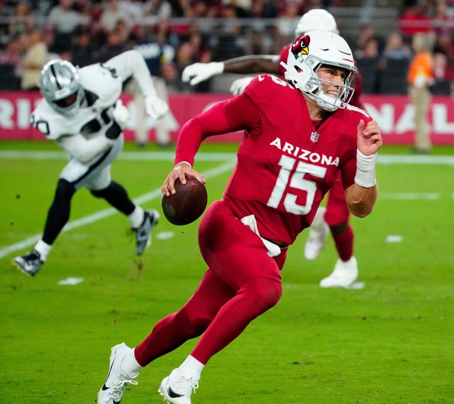 Cardinals quarterback Clayton Tune (15) scrambles against the Raiders during a preseason game at State Farm Stadium in Glendale on Aug. 23, 2025.