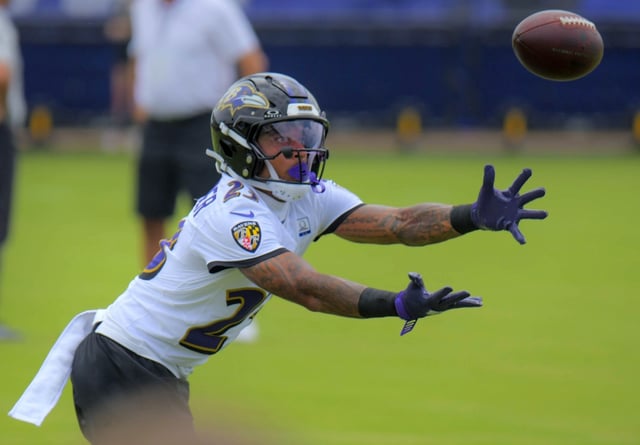 Baltimore Ravens cornerback Jaire Alexander catches a pass during training camp. (Karl Merton Ferron/Staff)