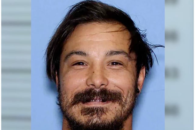 This undated photo provided by the Wenatchee Police Department shows Travis Caleb Decker, who is wanted in connection with the deaths of his three daughters.