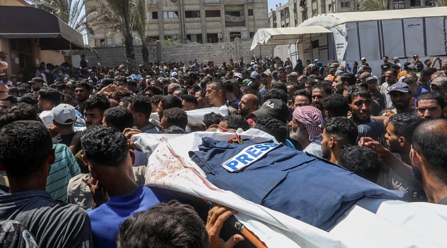 A funeral ceremony is being held in the courtyard of Nasser Hospital for Reuters photojournalist Hossam al-Masri, Al Jazeera cameraman Mohammed Salameh, journalist Maryam Abu Deqqa, who worked with several media outlets including Independent Arabia and AP, and NBC News journalist Moaz Abu Taha, all of whom were killed in an Israeli attack on the hospital in Khan Yunis, Gaza on August 25, 2025. (Abed Rahim Khatib/Anadolu via Getty Images)