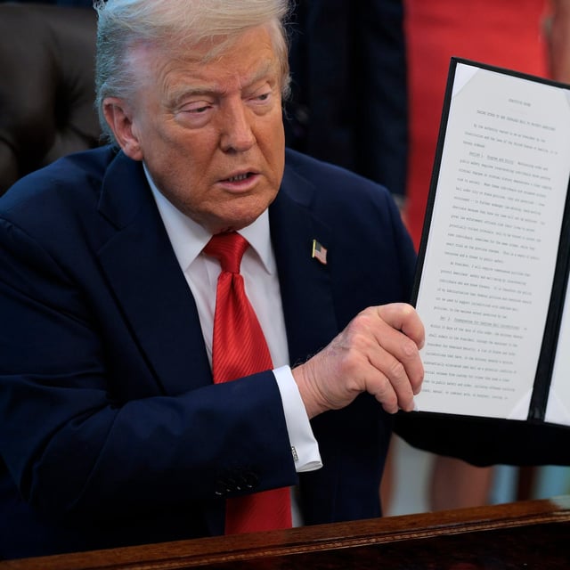 WASHINGTON, DC - AUGUST 25: U.S. President Donald Trump signs executive orders in the Oval Office at the White House on August 25, 2025 in Washington, DC. Furthering his federal takeover of the capital city’s law enforcement, Trump signed orders ending cashless bail in the District of Columbia, mandating prosecution for people who desecrate the American flag, including by burning it, and other orders. (Photo by Chip Somodevilla/Getty Images)