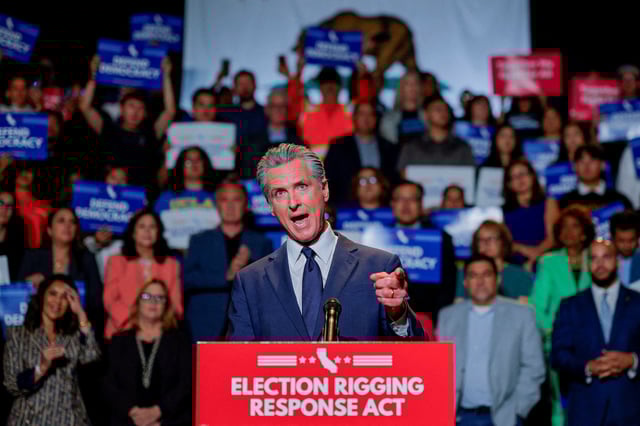California Governor Gavin Newsom, along with local congressional representatives, state officials and supporters, speaks as he announces the redrawing of California's congressional maps, calling on voters to approve a ballot measure, in response to a similar move in Texas being supported by U.S. President Donald Trump, in Los Angeles, California, U.S., August 14, 2025.  REUTERS/Mike Blake/File Photo