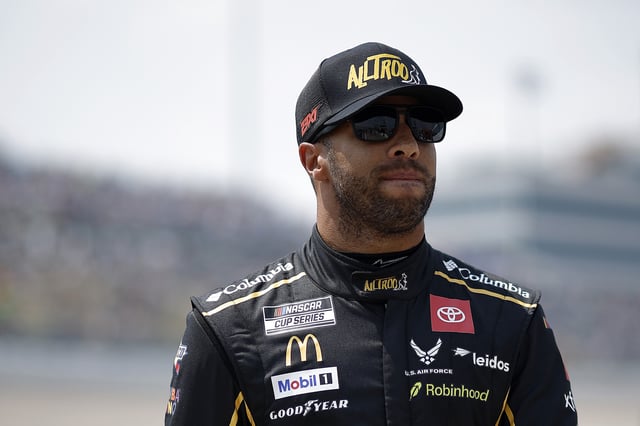 Bubba Wallace, driver of the #23 Alltroo Toyota, walks the grid during qualifying for the NASCAR Cup Series Iowa Corn 350 Powered by Ethanol at Iowa Speedway on August 02, 2025 in Newton, Iowa.