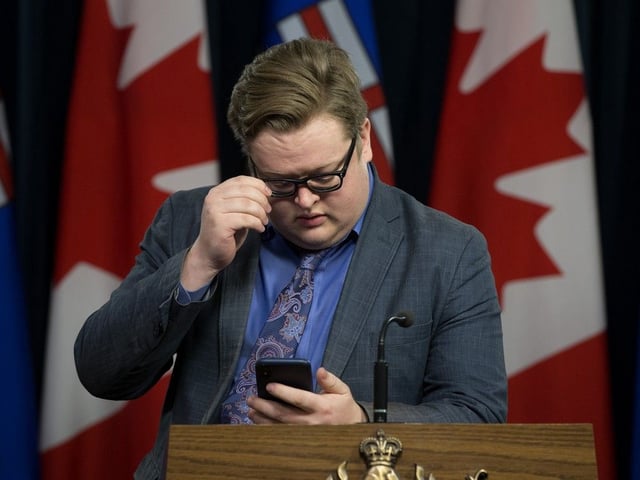  Justin Brattinga stands at the podium prior to a scheduled press conference in 2019.