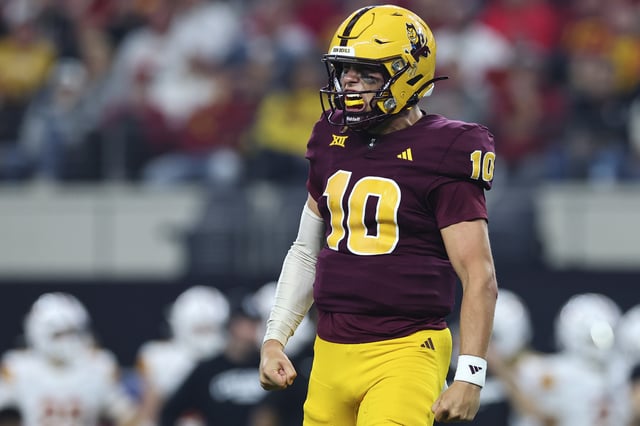 Sam Leavitt #10 of the Arizona State Sun Devils celebrates during the first half of the Big 12 Championship game against the Iowa State Cyclones at AT&T Stadium on December 7, 2024 in Arlington, Texas.