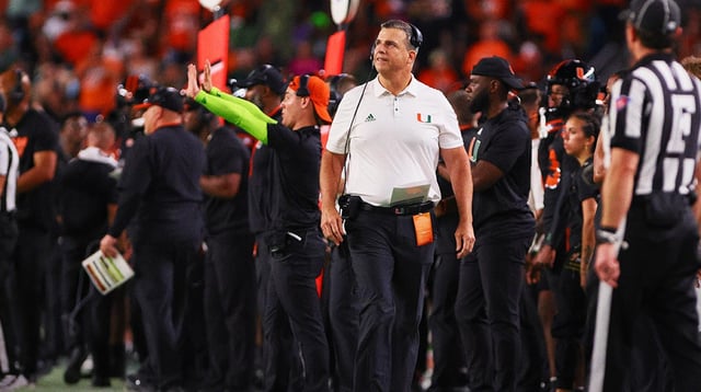 Oct 26, 2024; Miami Gardens, Florida, USA; Miami Hurricanes head coach Mario Cristobal watches from the sideline against the Florida State Seminoles during the third quarter at Hard Rock Stadium. Mandatory Credit: Sam Navarro-Imagn Images