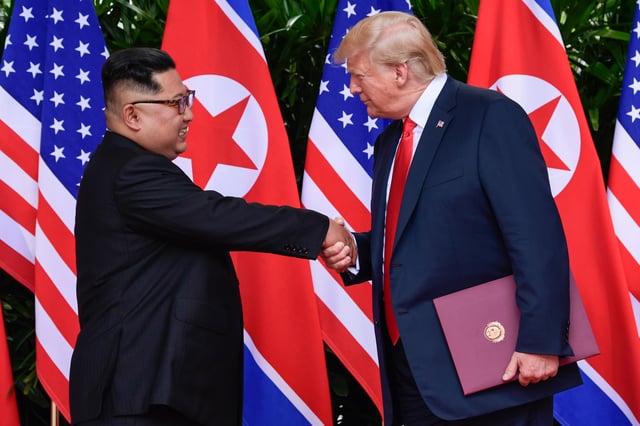 FILE - In this June 12, 2018, file photo, North Korean leader Kim Jong Un, left, and U.S. President Donald Trump shake hands at the conclusion of their meetings at the Capella resort on Sentosa Island in Singapore. U.S. analysts say they have located more than half of an estimated 20 secret North Korean missile development facilities. The findings come as the Trump administration’s denuclearization talks with the North appear to have stalled. And they highlight the challenge the U.S. faces in ensuring that North Korea complies with any eventual agreement that covers its nuclear and missile programs.  (AP Photo/Susan Walsh, Pool, File)