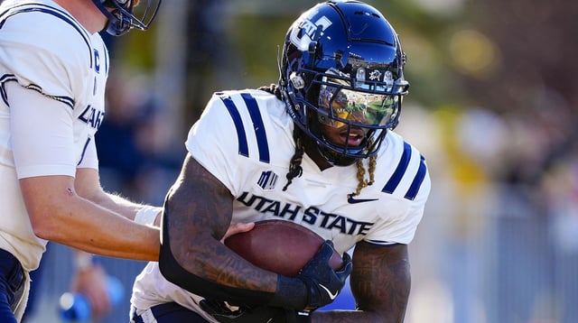 Oct 26, 2024; Laramie, Wyoming, USA; Utah State Aggies running back Rahsul Faison (3) warms up before the game against the Wyoming Cowboys at Jonah Field at War Memorial Stadium. Mandatory Credit: Troy Babbitt-Imagn Images