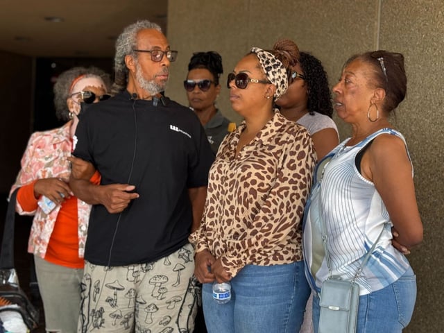 Ernest Taylor, left, stands outside Chula Vista Superior Court on Friday, when suspect Noel Trevino was supposed to be arraigned. Trevino is accused of killing Ernest’s wife, Wanda, at their National City home on Aug. 20, 2025. (Caleb Lunetta / The San Diego Union-Tribune)