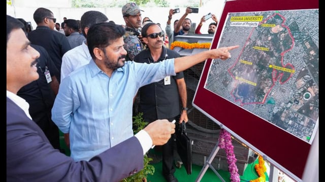 Telangana Chief Minister Revanth Reddy inspecting a map during the inauguration of newly constructed hostels at Osmania University, in Hyderabad on Monday. (AGENCIES)