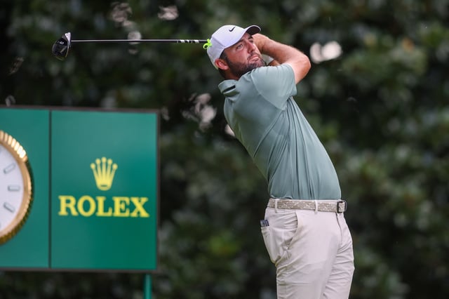 Aug 24, 2025; Atlanta, Georgia, USA; Scottie Scheffler plays his shot from the 17th tee during the final round of the TOUR Championship golf tournament. Mandatory Credit: Brett Davis-Imagn Images