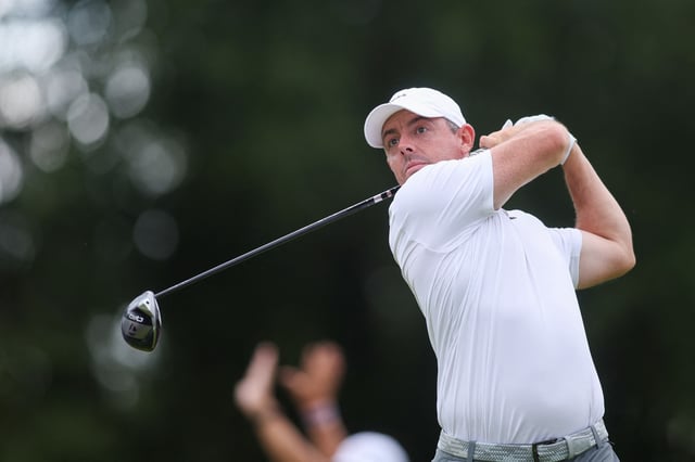 Aug 23, 2025; Atlanta, Georgia, USA; Rory McIlroy plays his shot from the 18th tee during the third round of the TOUR Championship golf tournament. Mandatory Credit: Brett Davis-Imagn Images