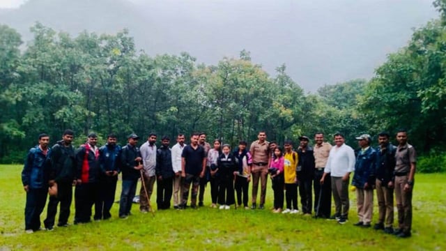 Trekker group with rescue team. Authorities said leaving the regular trail, the group reached a difficult spot and got stranded on cliff during Sinhagad Fort trek. (HT)