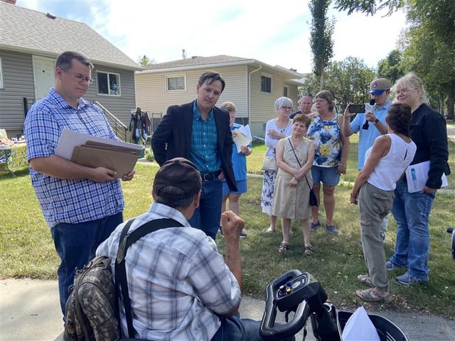 Alberta's Transportation Minister Devin Dreeshen meets with Denton neighbourhood residents about bike lanes.