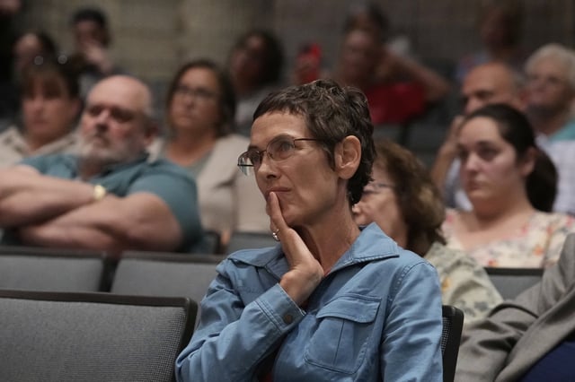 People listen as Republican Rep. Mark Alford addresses attendees at a town hall, Monday, Aug. 25, 2025, in Bolivar, Mo. (AP Photo/Charlie Riedel)