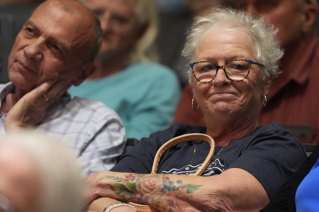 People listen as Republican Rep. Mark Alford addresses attendees at a town hall, Monday, Aug. 25, 2025, in Bolivar, Mo. (AP Photo/Charlie Riedel)
