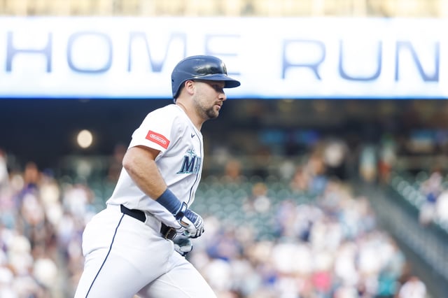 Aug 25, 2025; Seattle, Washington, USA; Seattle Mariners catcher Cal Raleigh (29) runs the bases after hitting a solo-home run against the San Diego Padres during the first inning at T-Mobile Park. The home run is the 50th of the season for Raleigh. Mandatory Credit: Joe Nicholson-Imagn Images