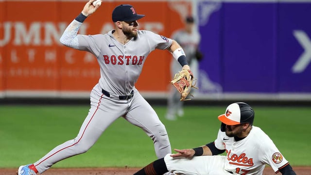 Aug 25, 2025; Baltimore, Maryland, USA; Boston Red Sox shortstop Trevor Story (10) throws to first as Baltimore Orioles is out at second for a double play during the sixth inning at Oriole Park at Camden Yards. Mandatory Credit: Daniel Kucin Jr.-Imagn Images