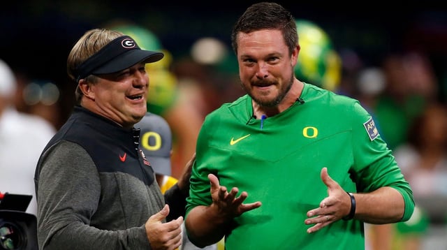 Georgia head coach Kirby Smart and Oregon head coach Dan Lanning meet during warm ups before the start of the Chick-fil-A Kickoff NCAA college football game between Oregon and Georgia in Atlanta, on Saturday, Sept. 3, 2022.